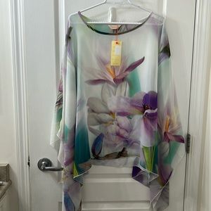 Gorgeous silky shawl
Watercolour effect
Orchid design
Versatile
